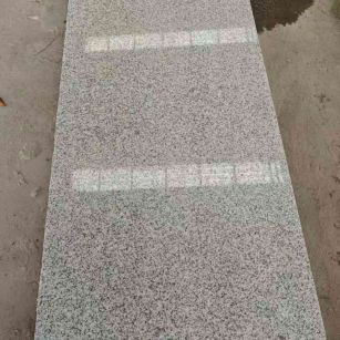 丽水芝麻白光面毛板